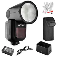 Godox V1 Canon saderīgs gredzenveida zibspuldzes aparāts ar pilnu komplektu: bezvadu 2.4 GHz zibspuldzes galva, baterija, lādētājs, cimdi un aizsargmaciņš, redzams no dažādiem leņķiemGodox V1 Canon saderīgs gredzenveida zibspuldzes aparāts ar pilnu komplektu: bezvadu 2.4 GHz zibspuldzes galva, baterija, lādētājs, cimdi un aizsargmaciņš, redzams no dažādiem leņķiem