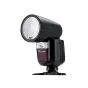 Godox V1 Canon saderīgs gaismas burtnis ar apaļo galvu, automātisko 24–105 mm reflektoru un bezvadu 2.4 GHz kontroli, attēls no sāna ar atvērtu bateriju nodalījumu