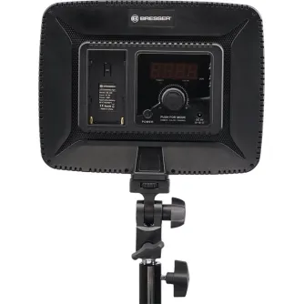 Back view of the Bresser BR‑F36B 36 W bi‑color LED panel, showing the battery compartment, power button, colour temperature dial and cold‑shoe mount on a tripod