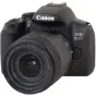 Цифровой зеркальный фотоаппарат Canon EOS 850D с объективом EF-S 18-135mm f/3.5-5.6 IS USM, вид спереди и сверху, демонстрирующий логотип бренда, название модели и характеристики объектива.