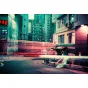 Vintage-style Lomography camera with Lomochrome Purple film capturing a moody urban night scene, showcasing rich purple hues and cinematic light trails for a psychedelic analog photography effect