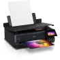 Epson EcoTank L8180 A3+ inkjet printer with Wi-Fi, EcoTank ink system, and borderless photo printing capability, featuring a printed photo of a tree against a colorful sunset partially ejected from the front and a blank sheet in