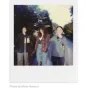 Vintage-style lifestyle shot featuring Polaroid Originals Color Film aesthetic with three people enjoying outdoor photography in natural light.
