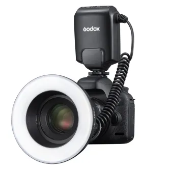 Godox ML150II Macro Ring Flash with coiled cable attached to camera lens and white ring diffuser for macro photography