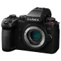 Panasonic LUMIX G9II mirrorless camera body front view without lens, black textured grip, LUMIX logo and G9II badge, top dials and sensor visible
