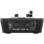 Aizmugures skats uz Roland V-1HD video komutašu, kurā redzami ieejas/izejas porti, audio miksera vadības elementi un fiziskie pogas. Iespējas ietver XLR un HDMI savienotājus, T-bar pārejas kontroli un LED indikatorus. Kompakta m