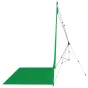 Westcott X-Drop green screen sweep backdrop kit with 5×12 ft wrinkle-resistant fabric mounted on a portable tripod stand, showcasing a seamless green corner setup.