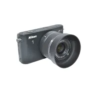 Nikon JJC HB-N101 Sun Hood (LH-N101) for Nikon lenses, showcasing its design and compatibility with Nikon VR 10-30mm f/3.5-5.6.Nikon JJC HB-N101 Sun Hood (LH-N101) for Nikon lenses, showcasing its design and compatibility with Nikon VR 10-30mm f/3.5-5.6.