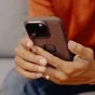 Peak Design Everyday Fabric Case V2 for iPhone 15 Pro Max with SlimLink magnetic attachment and finger loop, redwood color