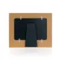 Обратная сторона фоторамки Zep Photo Frame DR2646 Lola Horizontal 10x15 cm с коричневой картонной основой и черным пластиковым креплением с четырьмя серебряными зажимами.