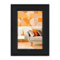 Фоторамка Zep DT434B Spoleto Black 30x40 см, установленная на стене с геометрическим искусством
