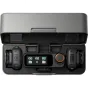 DJI Mic 3 wireless microphone system in an open charging case with two clip-on transmitters and a compact receiver featuring an AMOLED screen