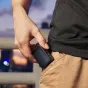 Godox X3Pro C 2.4G touchscreen TTL transmitter for Canon cameras, featuring a large LCD display and USB-C charging port held in hand