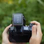 Godox X3Pro C 2.4G touchscreen TTL transmitter connected to Canon camera displaying live settings for flash groups A, B, C, and D