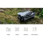 DJI Mini 5 Pro drone with camera and propellers on a moss-covered log in a forest