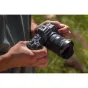 Sigma 15mm f/1.4 DC Contemporary ultra-wide lens for Canon RF APS-C mirrorless camera in use, showcasing the lens details and outdoor setting.