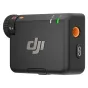 DJI Mic Mini 2 wireless microphone transmitter featuring a textured grip, orange accents, and LED indicators
