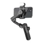 AOCHUAN XE gimbal with smartphone mounted, featuring three-axis stabilization, RGB lighting module, and ergonomic handle for precise video control
