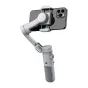 AOCHUAN X Gimbal with smartphone attached, side view showing 3-axis stabilization arm, built-in lighting, and control buttons for professional videography