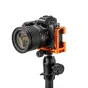 3 Legged Thing Zayne QD L bracket in copper for Nikon Z50 II mounted on a tripod with QD socket, allowing full access to camera ports and battery door.