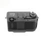 Fujifilm X-series camera body with JJC TA XHALF Black Thumb Up Grip attached, top view showing ergonomic thumb rest and cold shoe mount for accessories