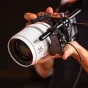 Viltrox NexusFocus F1 S single motor adapter with 35mm vintage lens for Sony E-mount cameras, showcasing AI autofocus technology and compact motor design in use