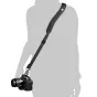 BlackRapid RS W2 ergonomic camera sling for women with DSLR camera attached, showcasing adjustable strap length and comfortable shoulder pad design