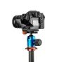 3 Legged Thing OLLIEQD B 90mm Arca-Swiss L bracket with OM System camera mounted on tripod ball head, showing easy access to battery door and ports, and QD compatibility