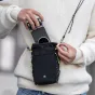 PGYTECH OneGo Casual Crossbody Bag featuring a Fujifilm X100-style camera grip, compact storage, and a lens cleaning cloth attached to the strap