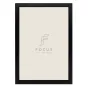 FOCUS Grace Black 60x80 acrylic glass photo frame featuring a minimalist logo design with 'FOCUS' and the tagline 'Love Your Photos' in elegant typography, complemented by a dark wooden border and a light background, perfect for
