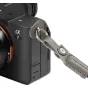 SmallRig Emperor Penguin Pattern Camera Strap attached to Sony Alpha 7 camera with padded wrist strap detail
