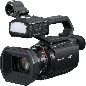 Камера Panasonic AG-CX20EJ 4K с откидной рукояткой и встроенной LED-подсветкой, вид спереди и сверху для профессионального видеопроизводства и вещания