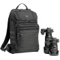 Рюкзак Think Tank DarkLight 20L с панелью MOLLE и тактическими ремнями, рядом с DSLR-камерой Nikon и телеобъективом для хранения профессионального фотооборудования