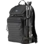 Think Tank DarkLight 20L backpack with laser-cut MOLLE panel and tactical side straps, featuring a mounted tripod for organizing photography gear.