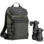 Think Tank DarkLight 20L backpack in olive green with MOLLE panel and tactical straps, paired with a DSLR camera to showcase its capacity for photography gear.