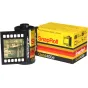 Мини-цифровая камера Escura SnapRoll Gold400e с эффектом плёночной съёмки, расположенная рядом с ретро-упаковкой и частично развёрнутая для показа ностальгического изображения на экране