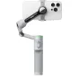 Insta360 Flow 2 Pro AI Tracker Bundle pelēkā krāsā ar pieslēgto viedtālruni, augšup skatā redzama magnētiskā fiksācija un izstiepts gimbal stabilizators