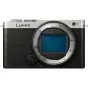 Panasonic Lumix DC-S9 full-frame mirrorless camera front view with electronic viewfinder display on, showcasing compact design and professional features