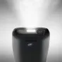 Задняя сторона мобильного телефона Panasonic KX-TF400EXB с кнопкой питания, светодиодным индикатором, микрофонной решёткой и стильным матовым черным дизайном