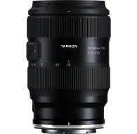 Tamron 35-100mm F2.8 Di III VXD Nikon Z lens front view with attached hood, featuring customizable focus control and zoom markingsTamron 35-100mm F2.8 Di III VXD Nikon Z lens front view with attached hood, featuring customizable focus control and zoom markings
