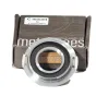 Metabones chrome C-mount to Sony E-mount adapter ring with precision brass construction, viewed from above on original packaging