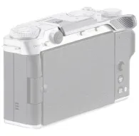 Tilta silver aluminum thumb bracket for Fujifilm X-M5 camera, mounted on hot shoe for ergonomic grip and stability during handheld shootingTilta silver aluminum thumb bracket for Fujifilm X-M5 camera, mounted on hot shoe for ergonomic grip and stability during handheld shooting