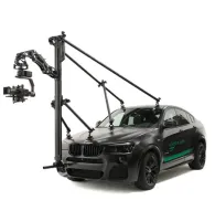 Tilta Hydra Shock-Absorbing Arm mounted on vehicle roof rail for professional cinematic stabilization, supporting heavy camera rigs up to 30 kgTilta Hydra Shock-Absorbing Arm mounted on vehicle roof rail for professional cinematic stabilization, supporting heavy camera rigs up to 30 kg