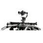 Tilta Hydra Shock-Absorbing Arm mounted on vehicle roof rails for ultra-smooth camera stabilization up to 66 lb, featuring spring-tension damping and rubber-dampened head for professional filmmaking