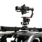 Tilta Hydra Shock Absorbing Arm Pro Kit with Ronin gimbal mounted on vehicle roof rail for stable dynamic filming, featuring hydraulic dampers and 30 kg load capacity