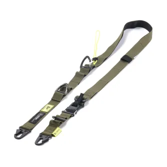 Tilta Fe multi-functional shoulder strap in green and black with adjustable carabiners and a yellow drawstring lock system, showcasing its design and attachment points.