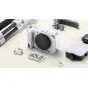 Tilta Full Camera Cage for Canon R50 V - silver modular cage with ARCA-Swiss plate, NATO rail, Cold Shoe, 1/4"-20 threads, ergonomic grip, and silicone padding for professional protection and versatile accessory mounting