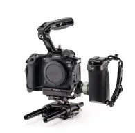 Tilta camera cage with cooling system for Canon R5 Mark II, featuring a side handle with battery pack, top handle, and adjustable baseplate for professional video rig setup.Tilta camera cage with cooling system for Canon R5 Mark II, featuring a side handle with battery pack, top handle, and adjustable baseplate for professional video rig setup.