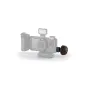 Tilta Khronos black circular wooden handle attached to the camera system, featuring an LED light and battery compartment.