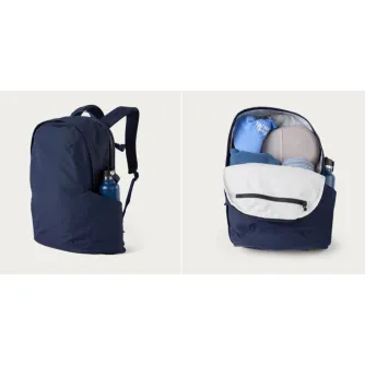 Moment Everything Backpack 17L Daypack navy side and front view with open compartments showing laptop sleeve, organized storage, and water bottle pockets